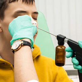 A boy receiving a nasal procedure